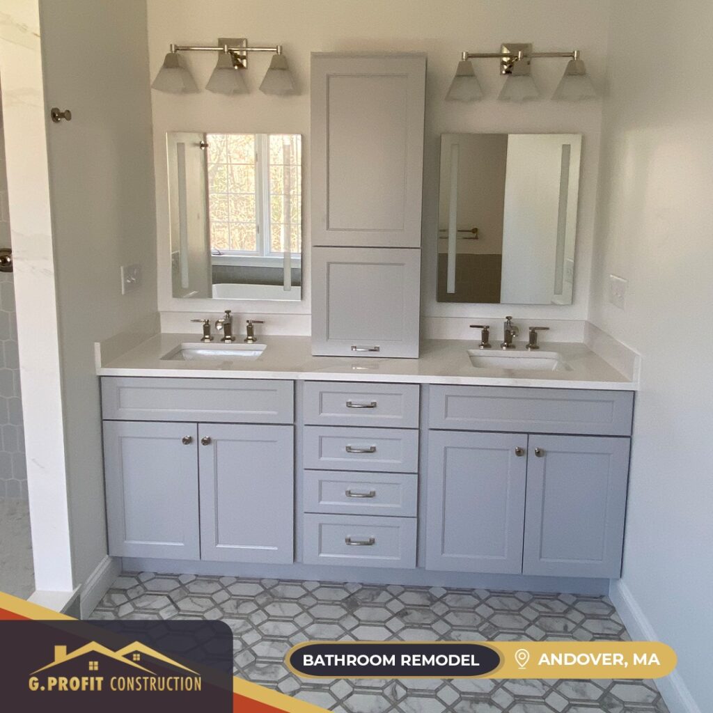 Modern gray bathroom vanity with dual sinks and mirrors.